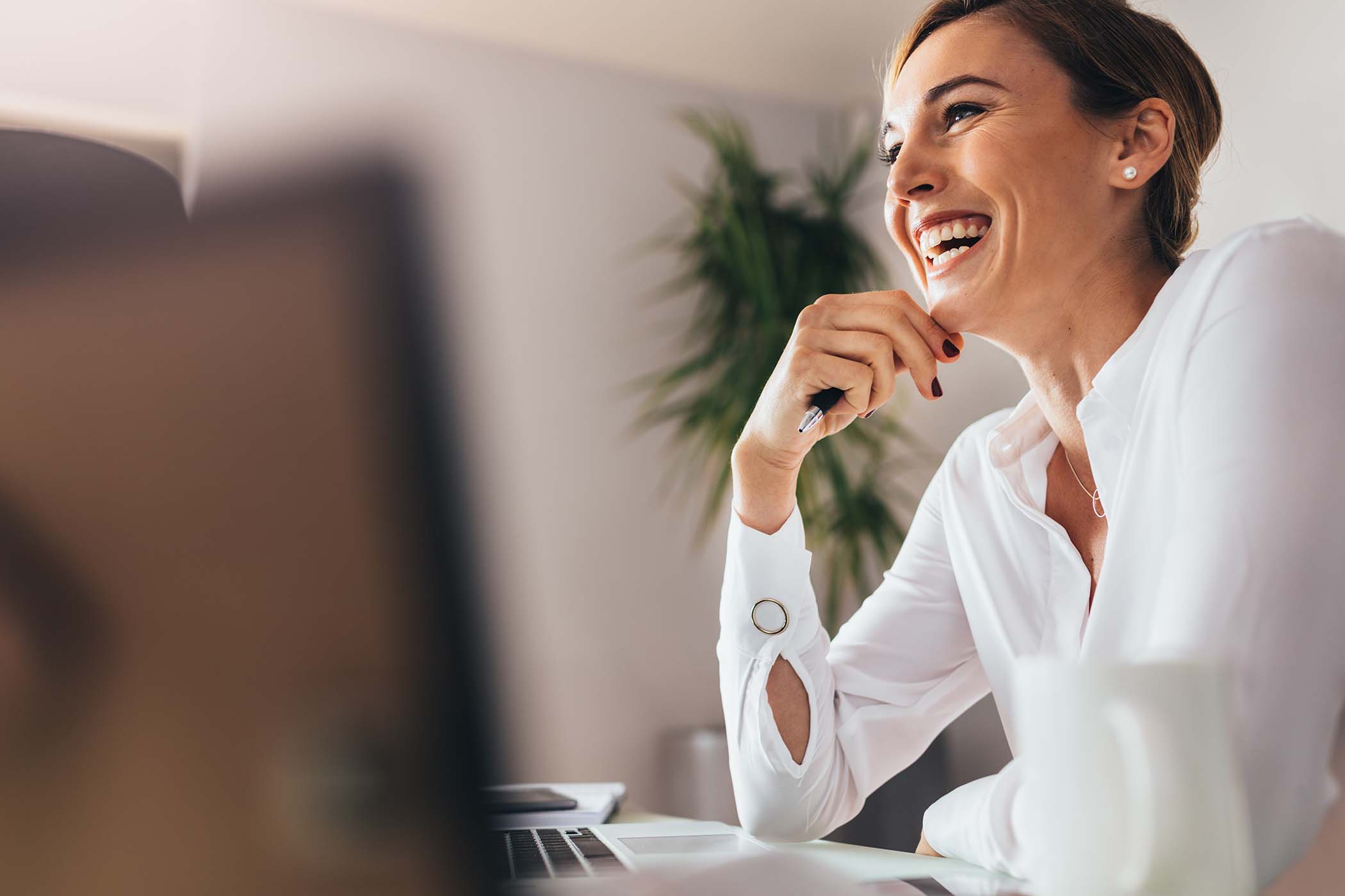 woman-office-laptop-happy